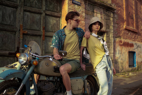 A stylish couple on the vintage motorcycle