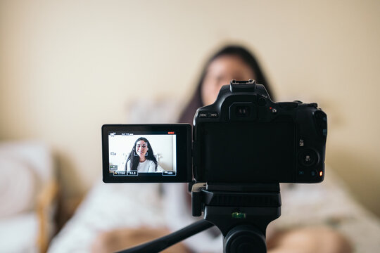 Woman vlogging at home