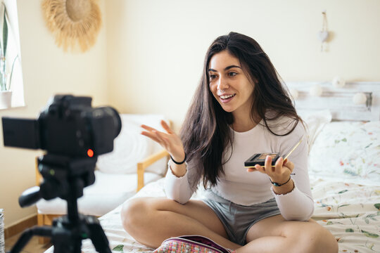 Young woman recording a makeup video blog