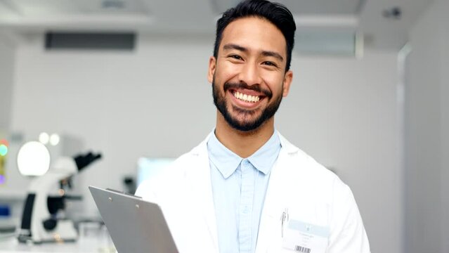 Portrait of a scientist working in a lab. Young pathologist and forensic researcher smiling and laughing while reading notes on a clipboard. Microbiologist feeling confident about developing a cure