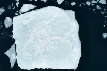 Greenland Arctic winter iceberg overhead aerial view of blank space