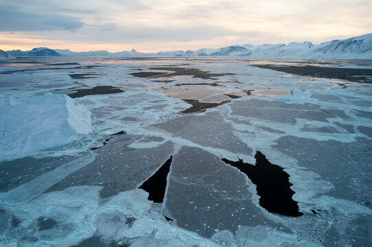 Greenland winter aerial view: sea ice fragments, Arctic global heating