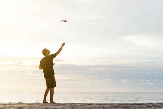 man flying a drone