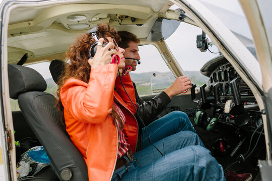 Young couple preparing themselves before take off