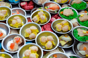 Chinese food "dim sum" on self service busket tray background.
Tradition Dimsum is local food in Songkhla, South of Thailand. 