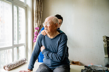 Physical therapist helping senior man patient