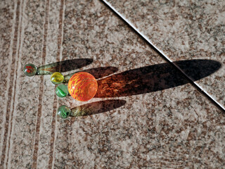 Group of marbles sitting on the floor