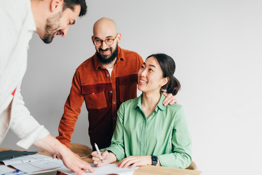 Couple Signing Real Estate Contract 