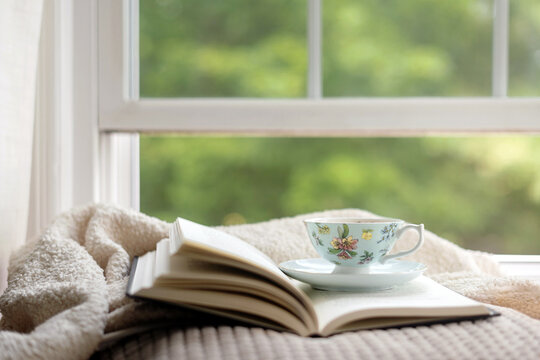 Tea and book by window