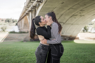 young lesbian couple together in a city park