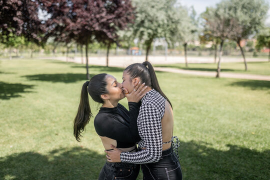 young lesbian couple together in a city park