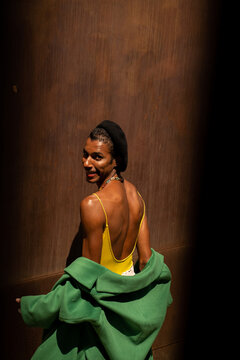 Fashionable black model posing at city