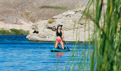 Female Rides Paddle Board