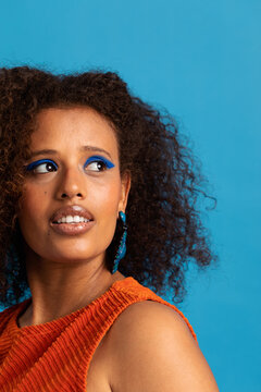 Exotic woman portrait on blue background