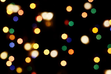 multicolored festive lights on a black background screensaver backdrop