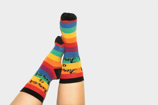 A anonymous person wearing rainbow socks - LGBT pride symbol