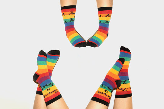 A anonymous person wearing rainbow socks - LGBT pride symbol