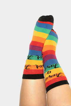 A anonymous person wearing rainbow socks - LGBT pride symbol