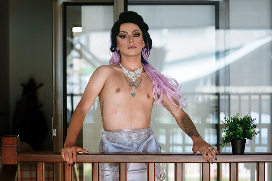 Man dressed as a woman with naked torso