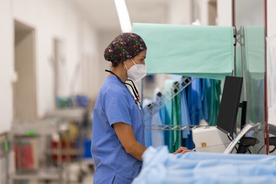 Nurse with a stethoscope works at computer