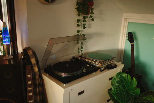 Vynil station with some discs and guitars