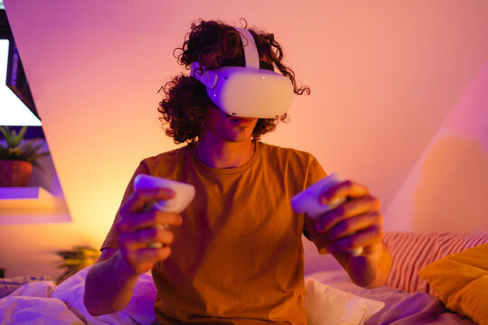 Man using VR headset in his bed