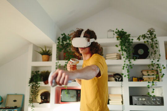 Boy playing boxing with virtual reality headset