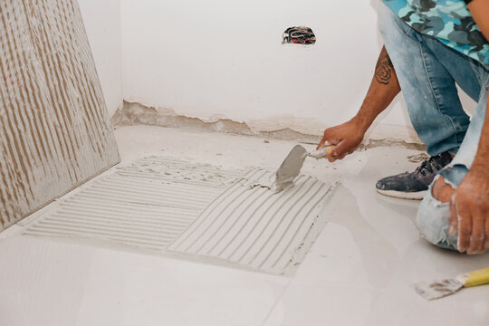 Ceramic installer working