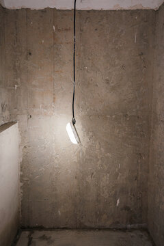 Light bulb hanging from a black wire