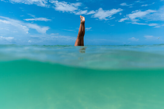 Person doing a handstand in the vibrant gulf