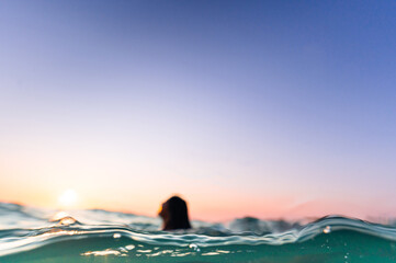 person rising to the surface of water