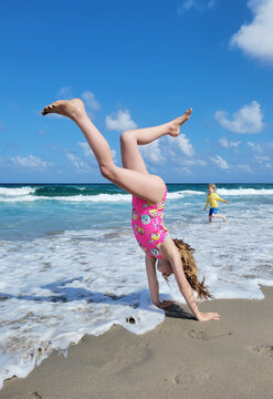 Mobile Image of Handstands on the Beach