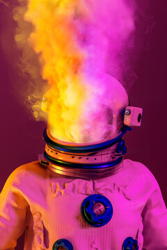 Astronaut blowing smoke from the helmet