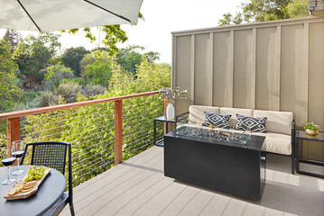 Outdoor patio deck with fireplace, table and wine and cheese