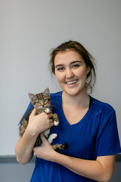 Veterinary Technician Holding Adorable Kitten