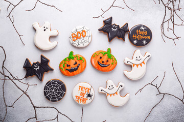 Halloween gingerbread cookies on stone background. Bright homemade cookies for Halloween party
