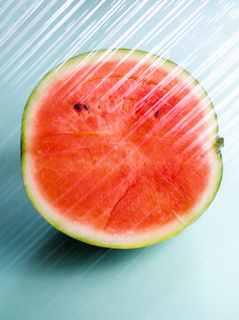 Watermelon behind a transparent plastic layer