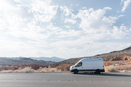 Camper van parked by desert highway