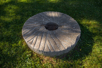 Millstones for grinding wheat or other grains. grinding stones. - obrazy, fototapety, plakaty