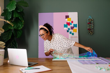 Latina making taffy candy graduation lei