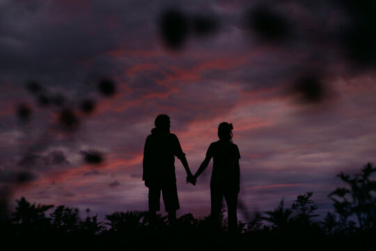 Two people silhouette sunset shot