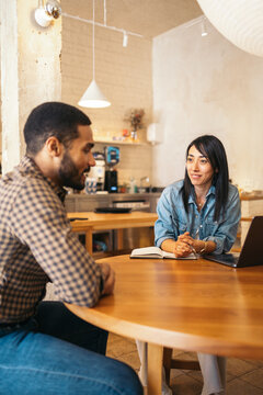 Business woman interviewing a candidate in an alternative workspace