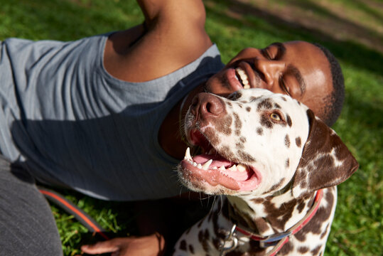 Close up of a men playing with food for his dog