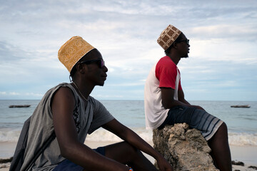 Portrait of two young men at the beach,  Zanzibar.