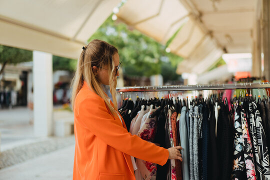 A woman in a clothes shop doing shopping