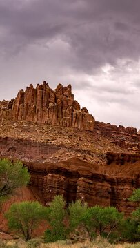 Timelapse of dramatic clouds moving over the cliffs in Capitol Reef in Utah