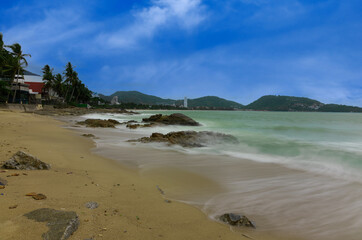 Colourful Skies Sunset over Patong Beach in Phuket island Thailand. Lovely turquoise blue waters, lush green mountains colourful skies and beautiful views of Pa Tong