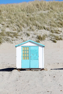 Painted little hut on a beach in Holland