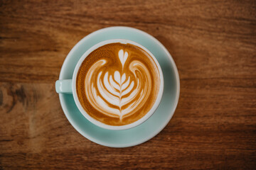 great latte art coffee design  and wooden table
