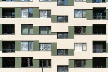 House with broken windows from a shell explosion.